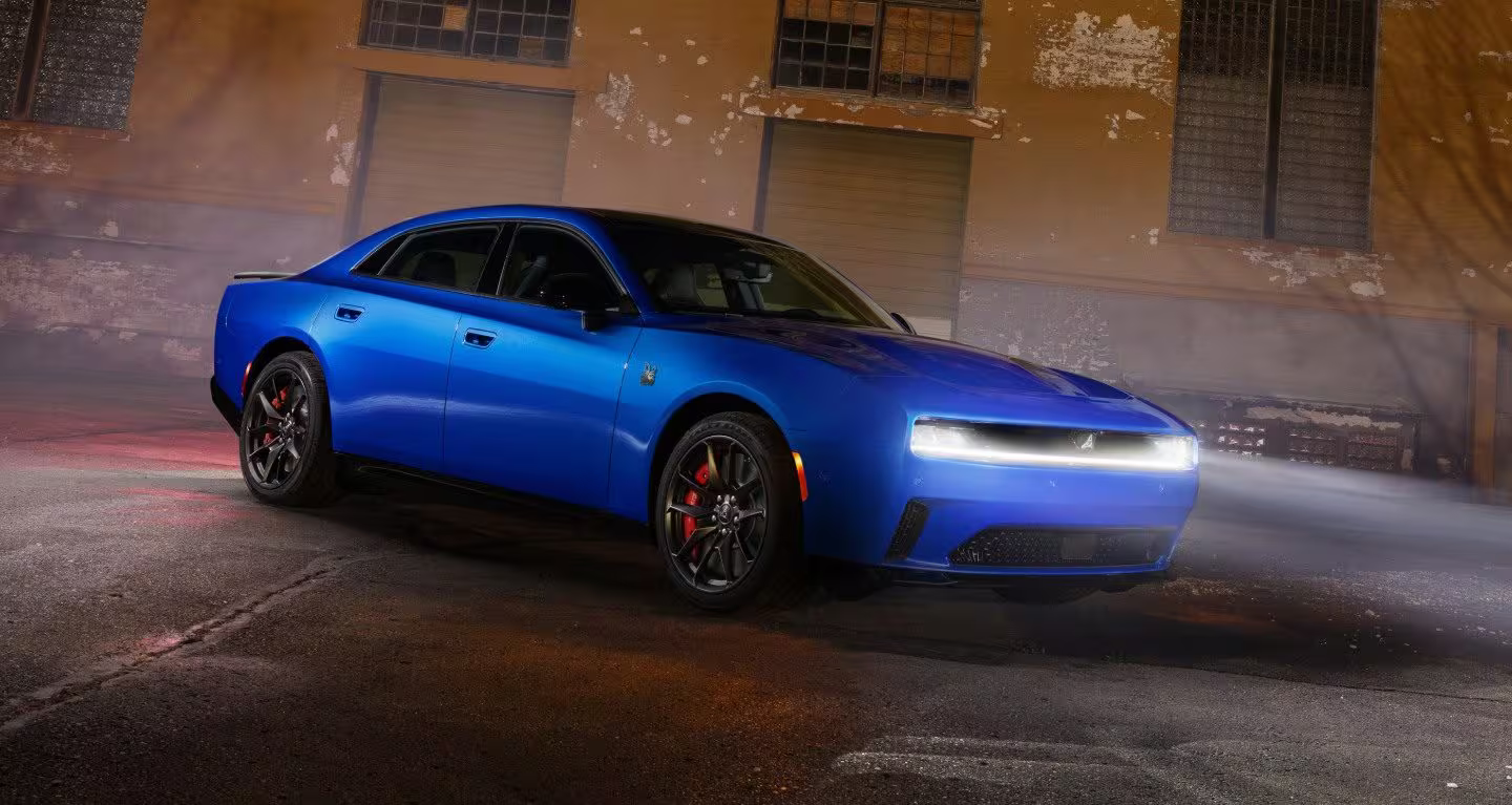 Dodge Charger Daytona outside at night with headlights on