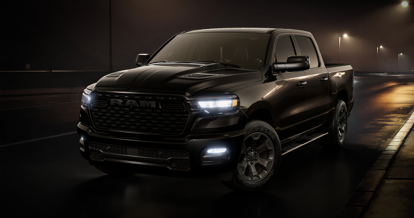 2026 RAM 1500 Express with headlights on at night
