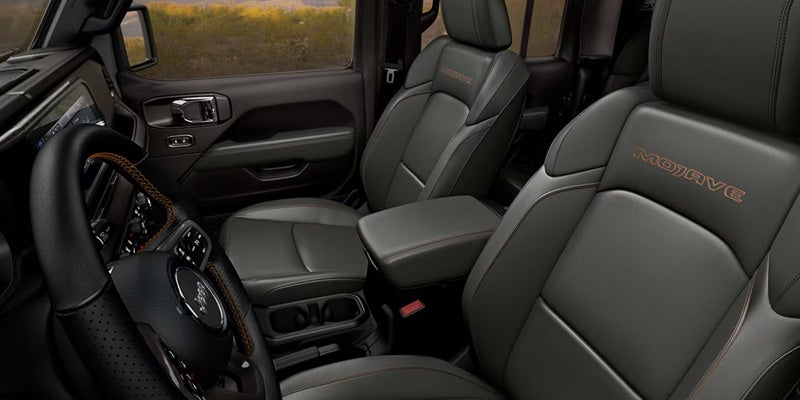 Jeep Gladiator interior with black leather seats and modern cabin features.