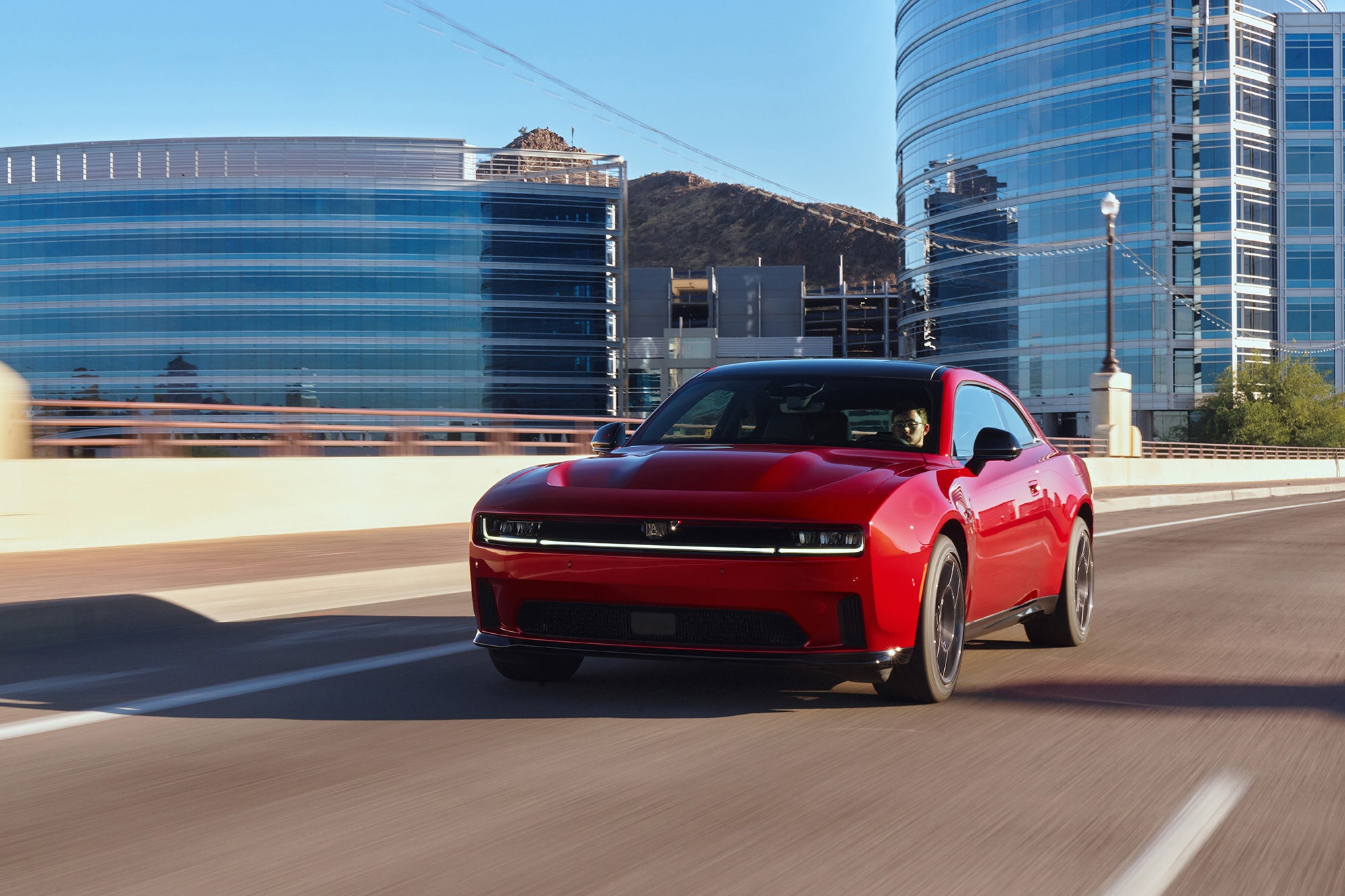 Red 2026 Dodge Charger on expressway.