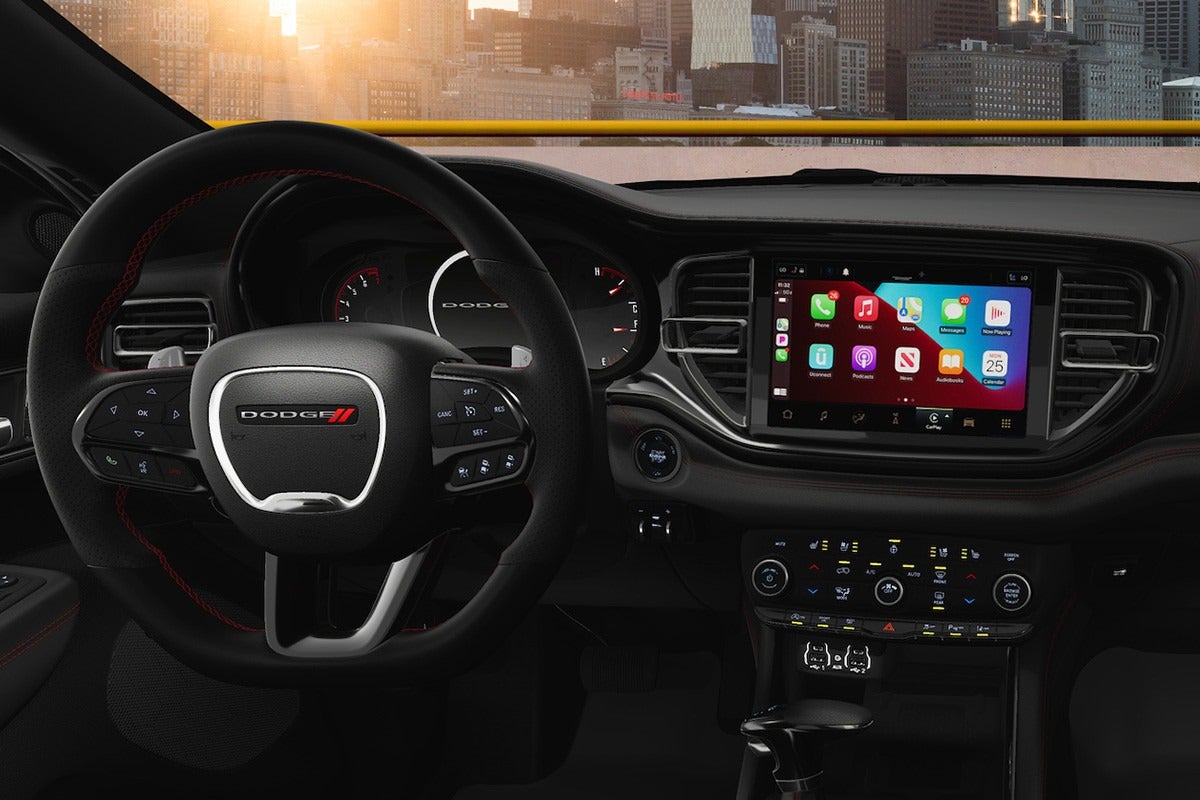 2025 Dodge Durango interior with a leather-wrapped steering wheel, touchscreen infotainment system, and digital dashboard. Available now at Windward Chrysler Dodge Jeep RAM.