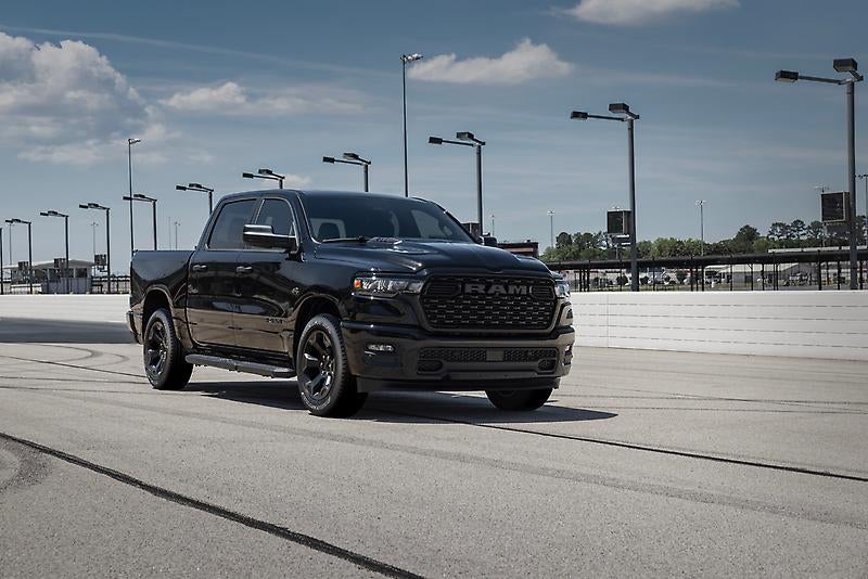 2026 RAM 1500 Express driving on race track.