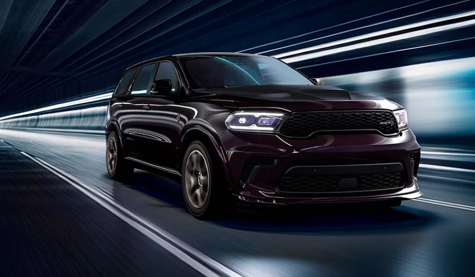 Dark 2026 Dodge Durango SUV driving through a tunnel.