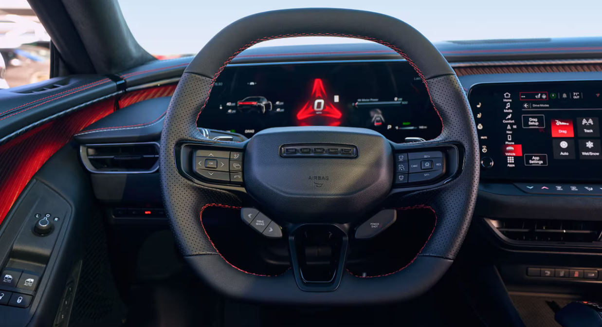 2026 Dodge Charger interior with steering wheel and digital display.