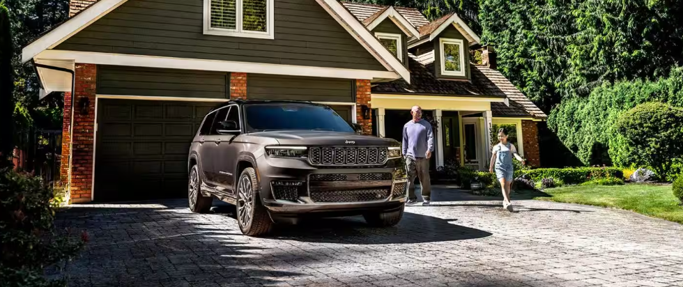 2026 Jeep® Grand Cherokee parked outside of family home.